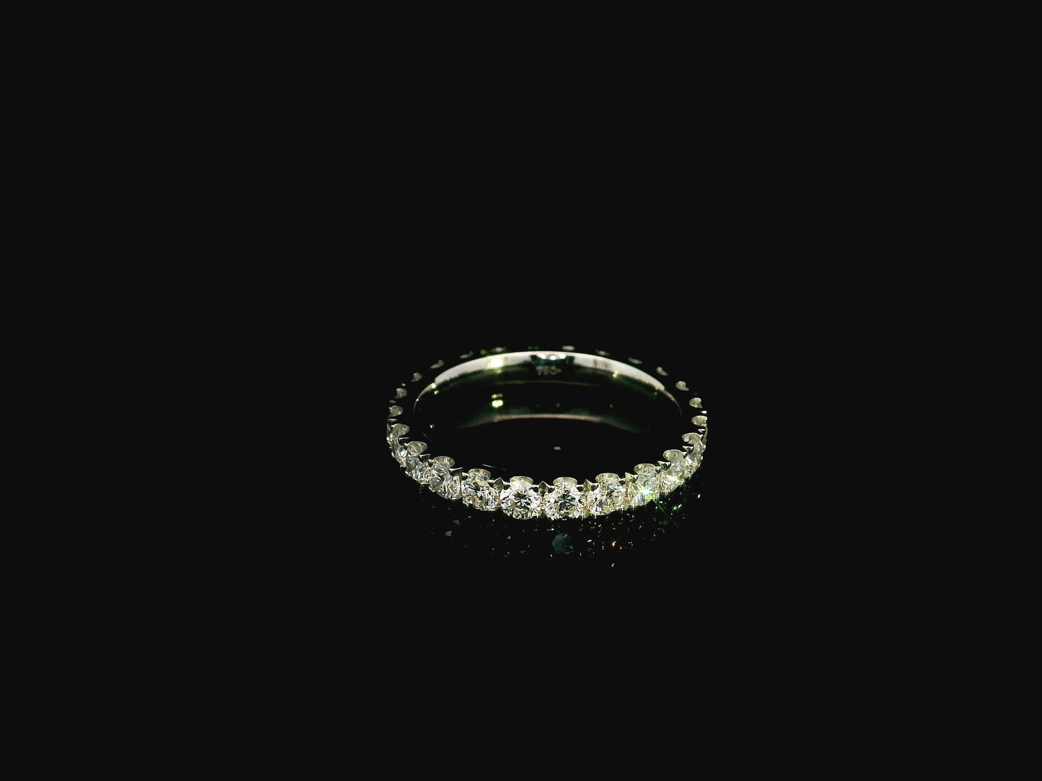 18K white gold full eternity diamond ring featuring 1.88 carats of natural round brilliant diamonds in prong setting, handcrafted as a made-to-order wedding band.