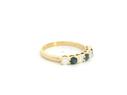 18K yellow gold half eternity ring featuring alternating natural blue sapphires and natural diamonds in a classic prong setting.
