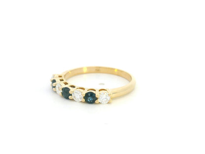 18K yellow gold half eternity ring featuring alternating natural blue sapphires and natural diamonds in a classic prong setting.