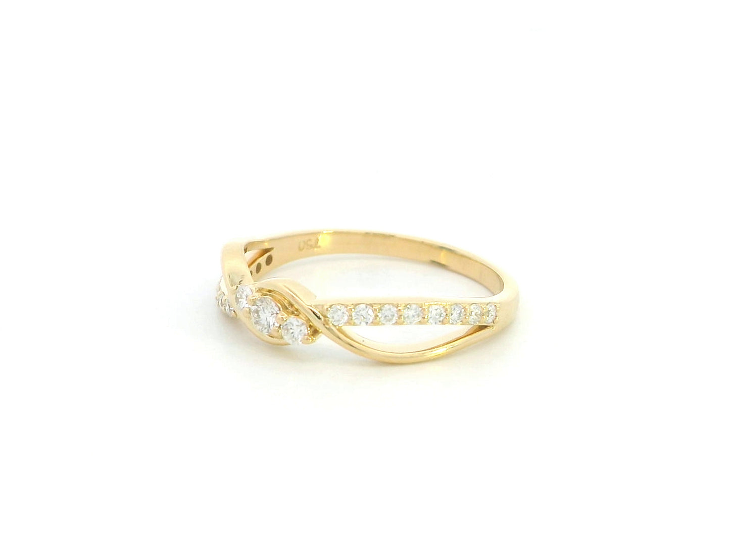Natural diamond infinity ring in solid 18K yellow gold featuring 0.28 carat round brilliant diamonds in an elegant flowing infinity design.