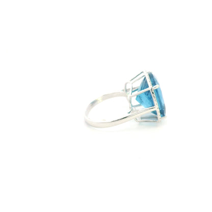 18K white gold cushion cut blue topaz halo ring featuring an 18.55 carat natural blue topaz surrounded by 0.37 carat natural diamonds.