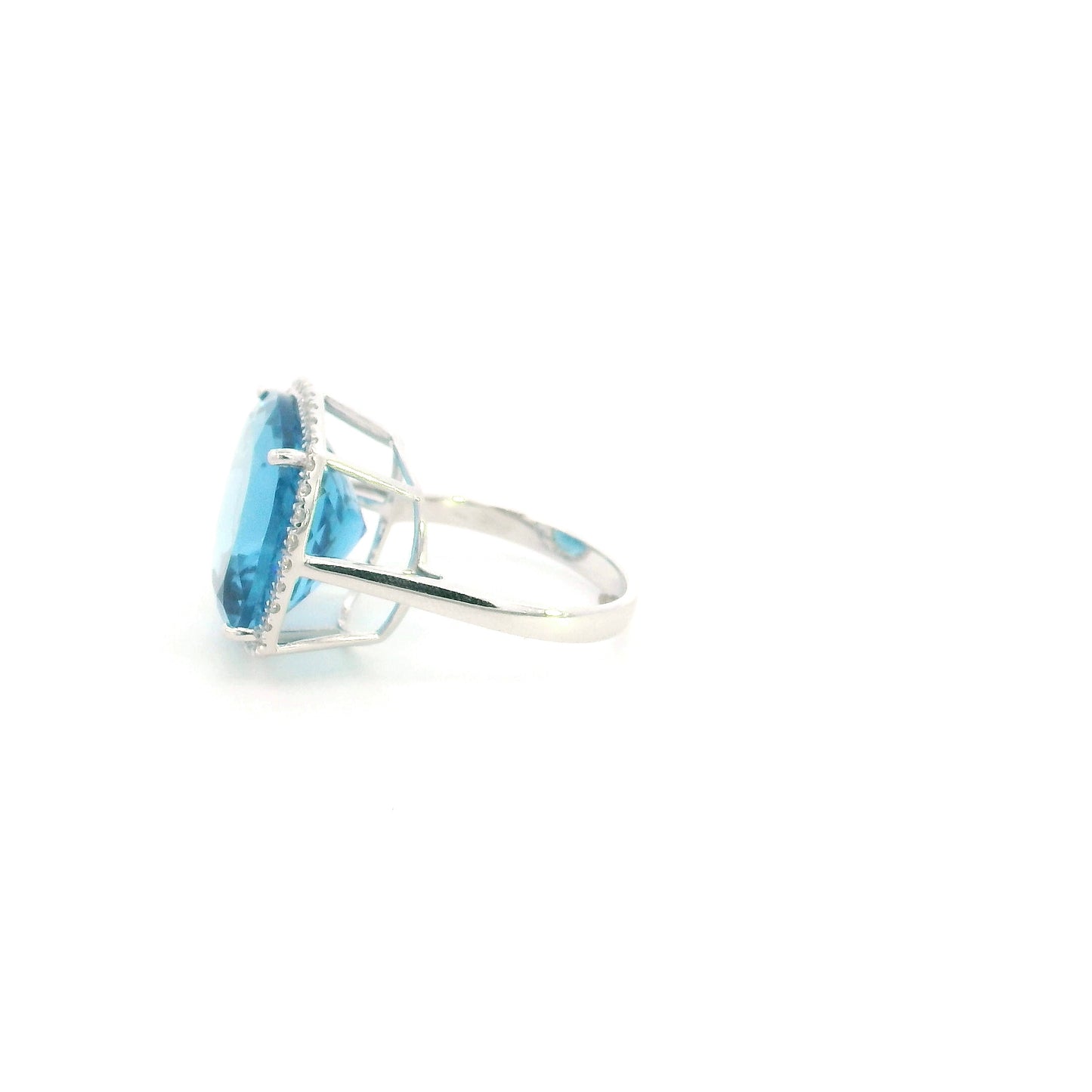 18K white gold cushion cut blue topaz halo ring featuring an 18.55 carat natural blue topaz surrounded by 0.37 carat natural diamonds.