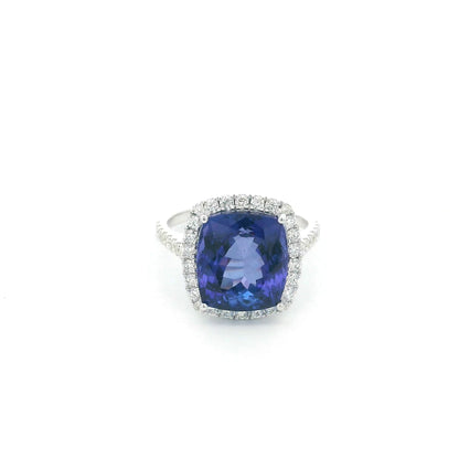 18K white gold cushion cut tanzanite halo ring featuring an 8.95 carat natural tanzanite surrounded by 0.69 carat natural diamonds with diamond-set shoulders.