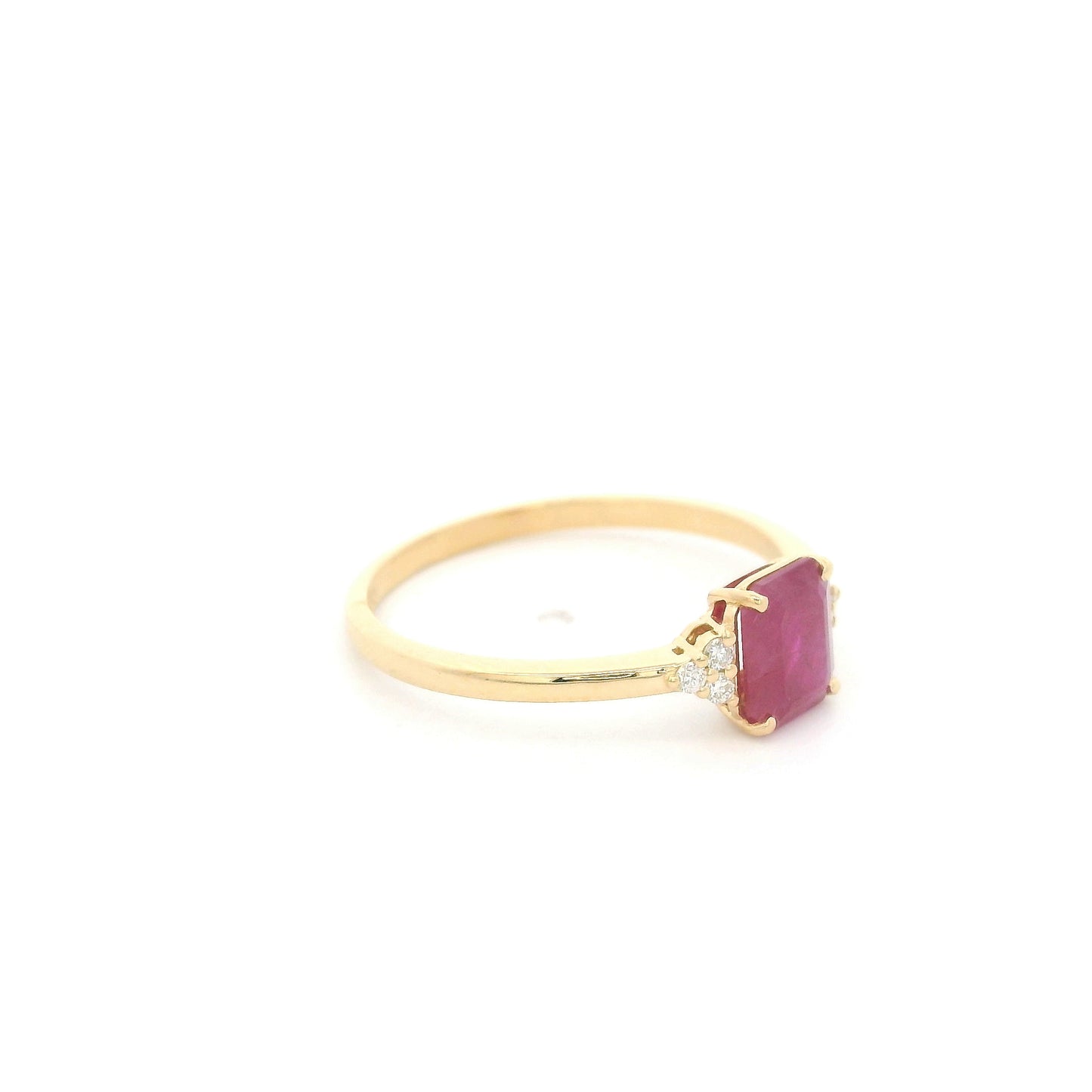 18K yellow gold emerald cut ruby ring featuring a 0.97 Carat natural ruby with sparkling natural diamond side accents.
