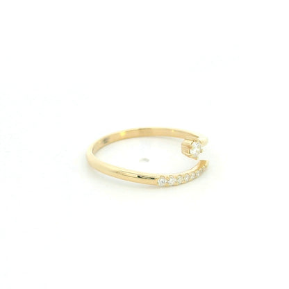 18K yellow gold open diamond ring featuring a round brilliant diamond with a curved row of natural diamonds in a minimalist wrap design.