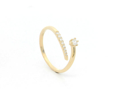 18K yellow gold open diamond ring featuring a round brilliant diamond with a curved row of natural diamonds in a minimalist wrap design.