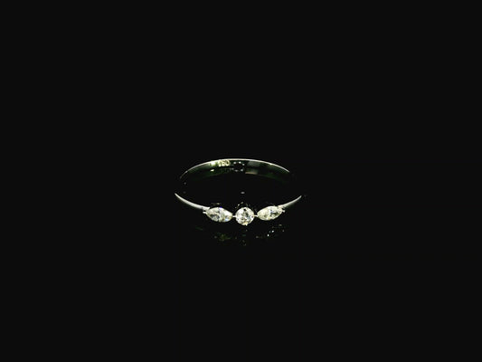 18K white gold three stone diamond ring featuring two marquise-cut diamonds and one round brilliant diamond with a total diamond weight of 0.22 carats.