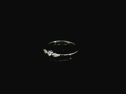 18K white gold three stone diamond ring featuring two marquise-cut diamonds and one round brilliant diamond with a total diamond weight of 0.22 carats.