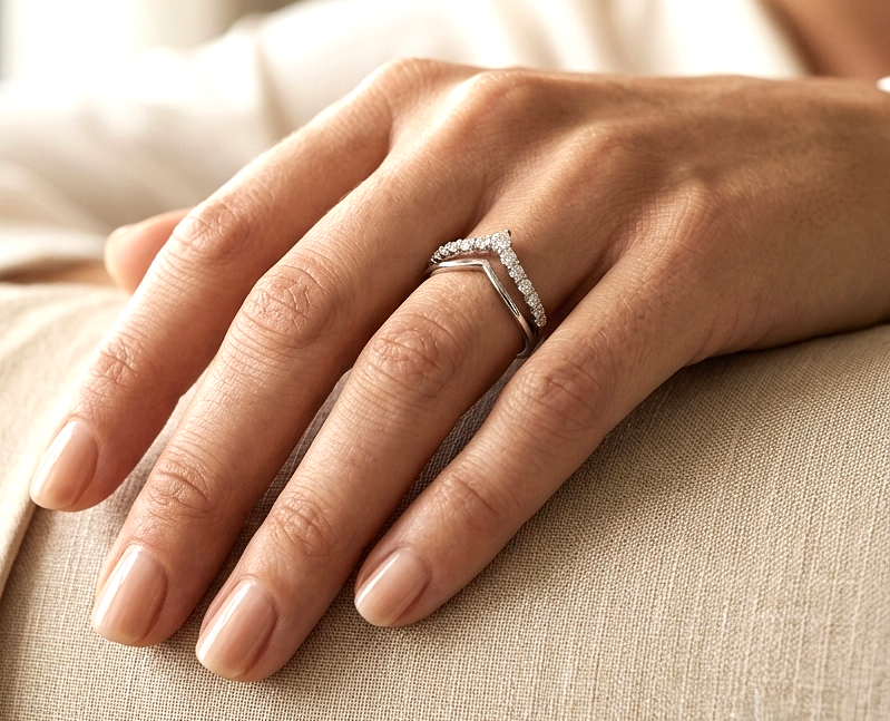 18K white gold graduated chevron diamond ring featuring 0.57 carats of natural diamonds in a V-shaped contour design, perfect as a wedding band, stack ring, or engagement ring enhancer.