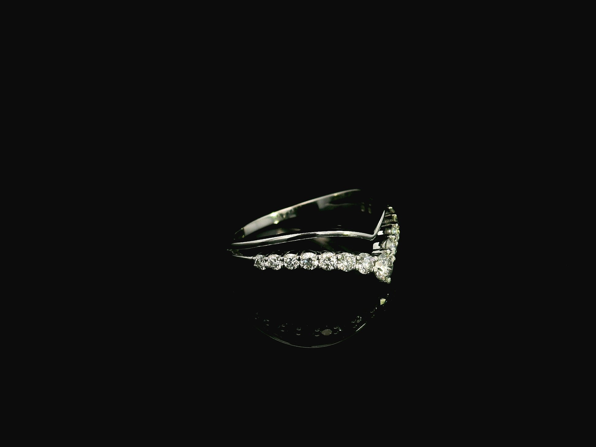 18K white gold graduated chevron diamond ring featuring 0.57 carats of natural diamonds in a V-shaped contour design, perfect as a wedding band, stack ring, or engagement ring enhancer.