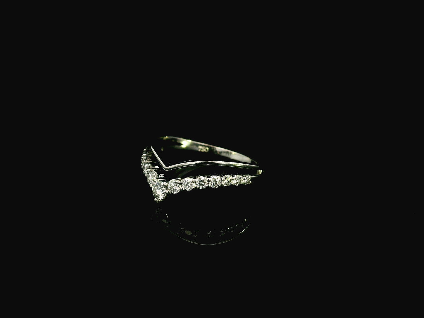 18K white gold graduated chevron diamond ring featuring 0.57 carats of natural diamonds in a V-shaped contour design, perfect as a wedding band, stack ring, or engagement ring enhancer.