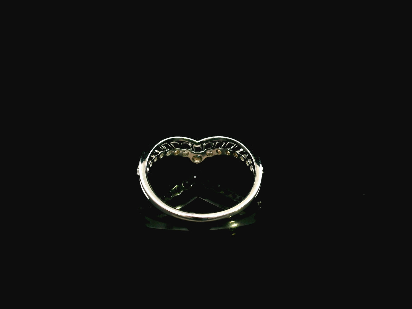 18K white gold graduated chevron diamond ring featuring 0.57 carats of natural diamonds in a V-shaped contour design, perfect as a wedding band, stack ring, or engagement ring enhancer.