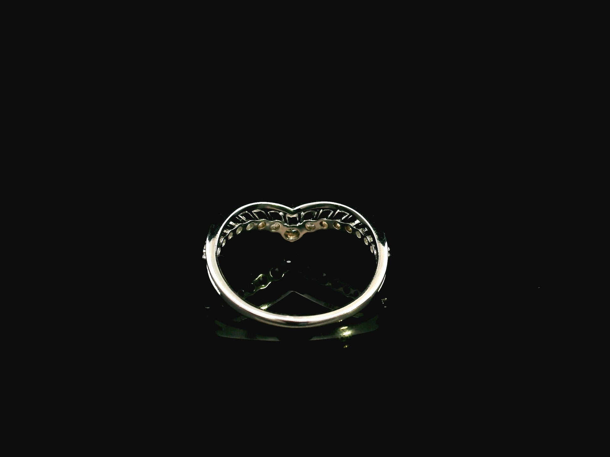 18K white gold graduated chevron diamond ring featuring 0.57 carats of natural diamonds in a V-shaped contour design, perfect as a wedding band, stack ring, or engagement ring enhancer.