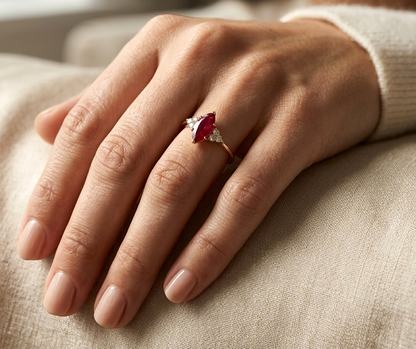 Natural 1.03 carat marquise ruby and diamond ring in solid 18K yellow gold with 0.21 carat natural diamond accents by Emirates Diamonds.
