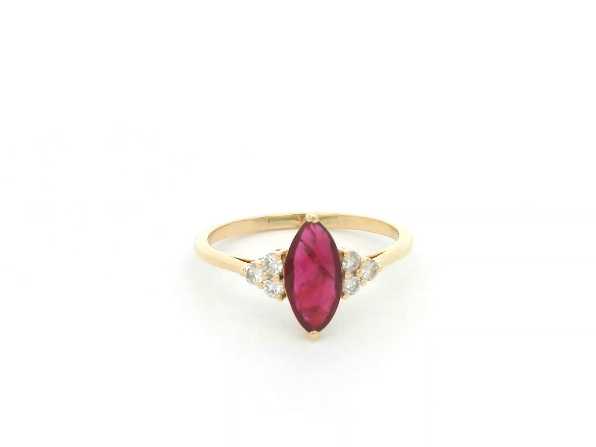 Natural 1.03 carat marquise ruby and diamond ring in solid 18K yellow gold with 0.21 carat natural diamond accents by Emirates Diamonds.