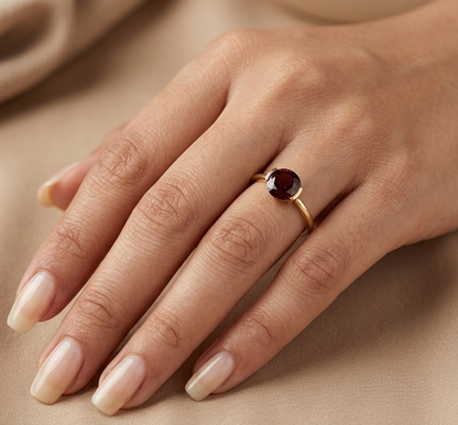 Natural 1.90 carat round garnet solitaire ring in solid 18K yellow gold featuring a contemporary semi-bezel style setting.