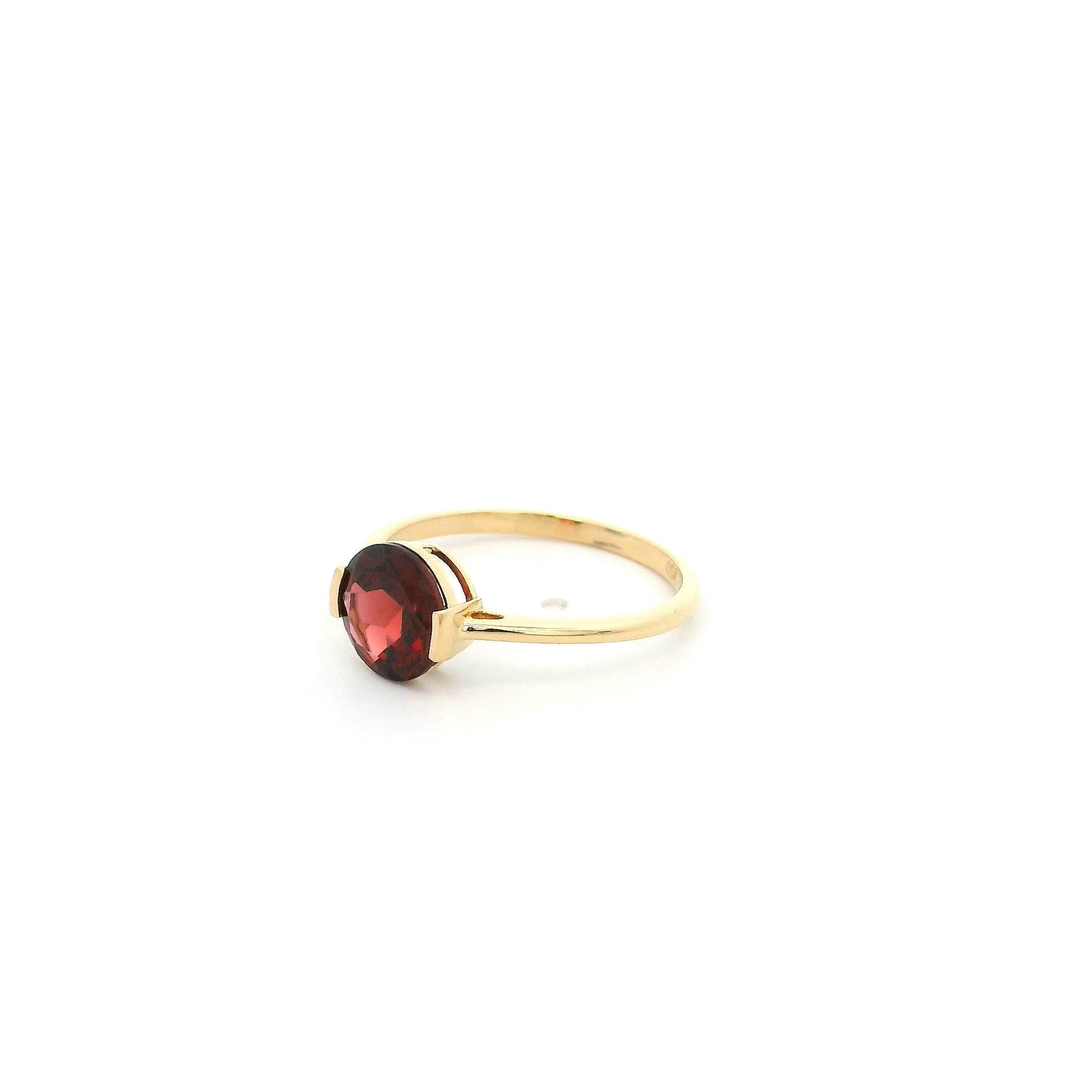 Natural 1.90 carat round garnet solitaire ring in solid 18K yellow gold featuring a contemporary semi-bezel style setting.