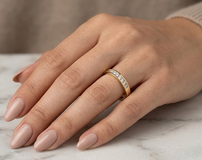 18K yellow gold princess cut diamond ring featuring 0.20 carat natural channel set diamonds in a polished minimalist band.