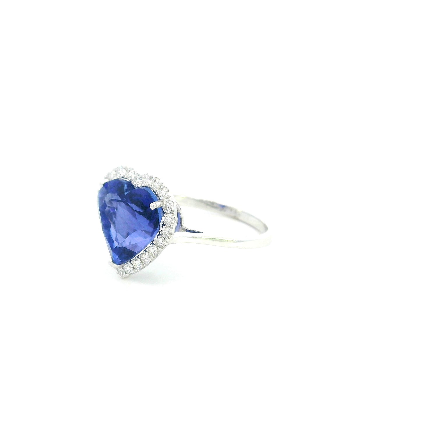 18K white gold heart tanzanite halo ring featuring a 5.89 Carat natural heart-shaped tanzanite surrounded by natural diamonds.