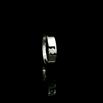 18K white gold floating diamond ring featuring a 0.08 carat natural round brilliant solitaire in a modern open band.