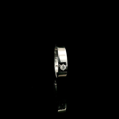 18K white gold floating diamond ring featuring a 0.08 carat natural round brilliant solitaire in a modern open band.