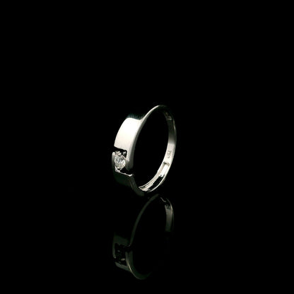 18K white gold floating diamond ring featuring a 0.08 carat natural round brilliant solitaire in a modern open band.