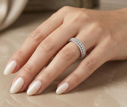 Natural three row diamond wedding band in solid 18K white gold featuring an elevated centre row of round brilliant diamonds with two pavé diamond rows, total diamond weight 0.62 carat.
