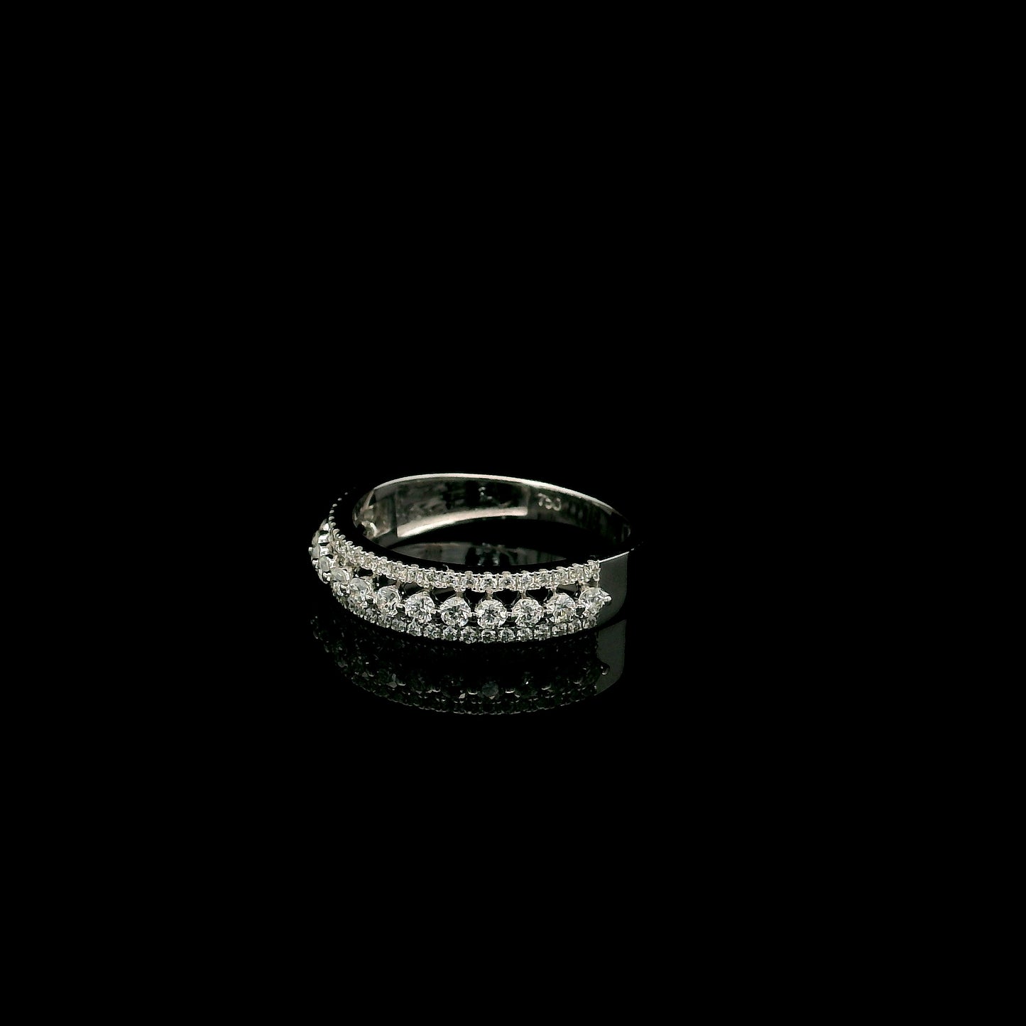 Natural three row diamond wedding band in solid 18K white gold featuring an elevated centre row of round brilliant diamonds with two pavé diamond rows, total diamond weight 0.62 carat.