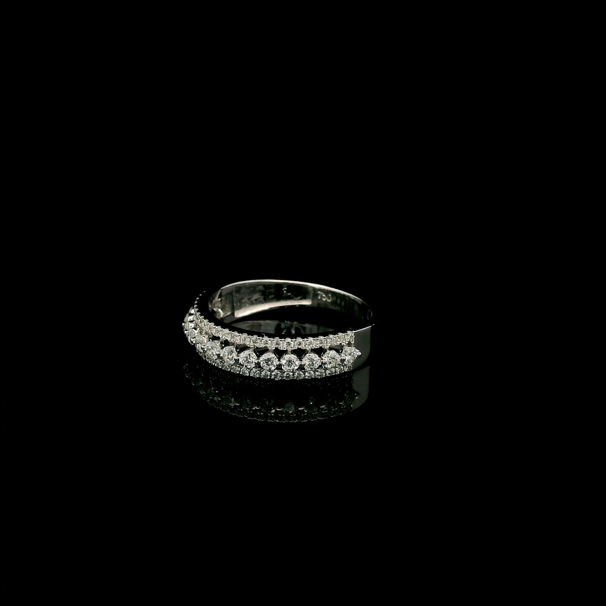 Natural three row diamond wedding band in solid 18K white gold featuring an elevated centre row of round brilliant diamonds with two pavé diamond rows, total diamond weight 0.62 carat.