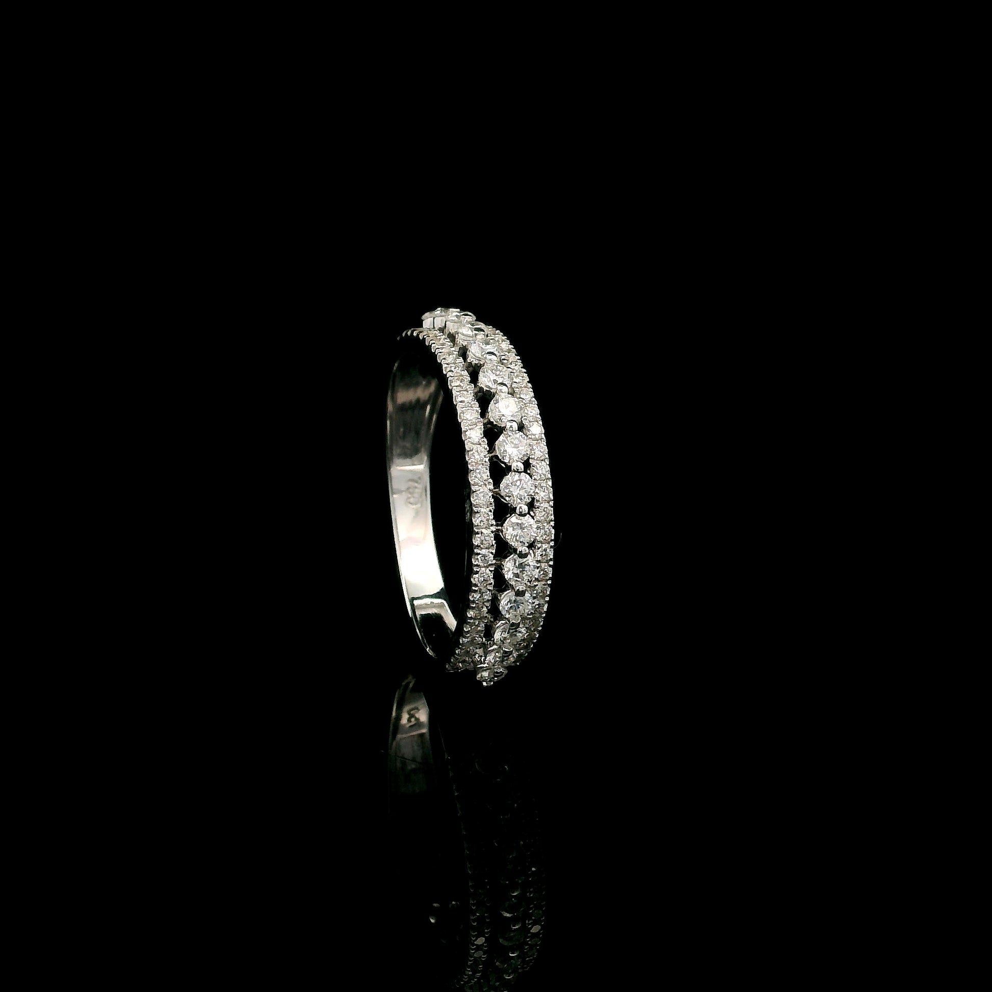 Natural three row diamond wedding band in solid 18K white gold featuring an elevated centre row of round brilliant diamonds with two pavé diamond rows, total diamond weight 0.62 carat.