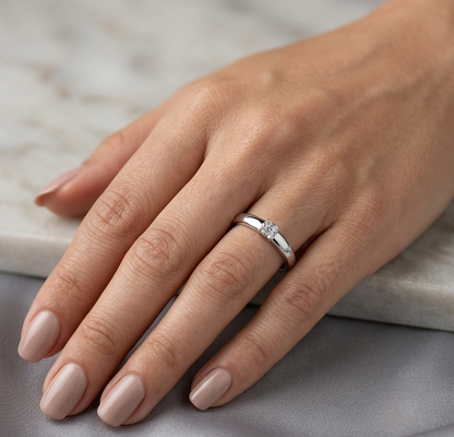 Minimalist natural diamond ring crafted in 18K white gold featuring a polished band with a four-diamond cluster.