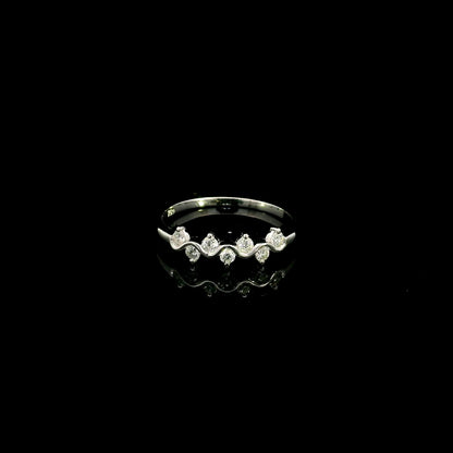 18K white gold diamond stack ring featuring natural round brilliant diamonds totaling 0.23 carat in a flowing shared prong design.