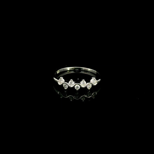 18K white gold diamond stack ring featuring natural round brilliant diamonds totaling 0.23 carat in a flowing shared prong design.