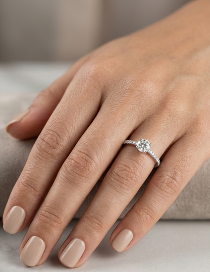 18K white gold round brilliant diamond solitaire engagement ring featuring a 0.51 carat GIA certified natural diamond with a pavé diamond band.