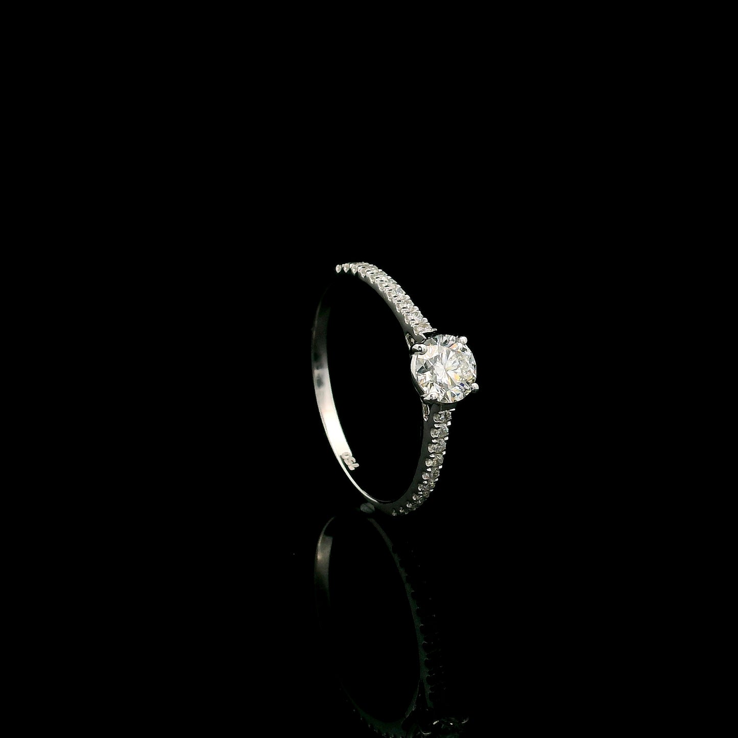 18K white gold round brilliant diamond solitaire engagement ring featuring a 0.51 carat GIA certified natural diamond with a pavé diamond band.