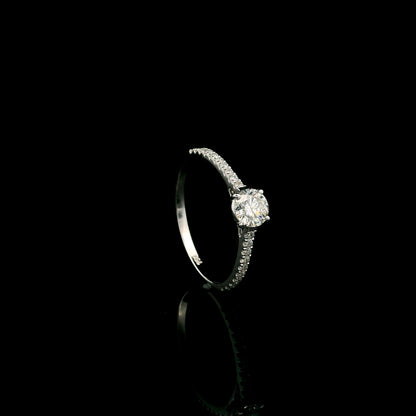 18K white gold round brilliant diamond solitaire engagement ring featuring a 0.51 carat GIA certified natural diamond with a pavé diamond band.