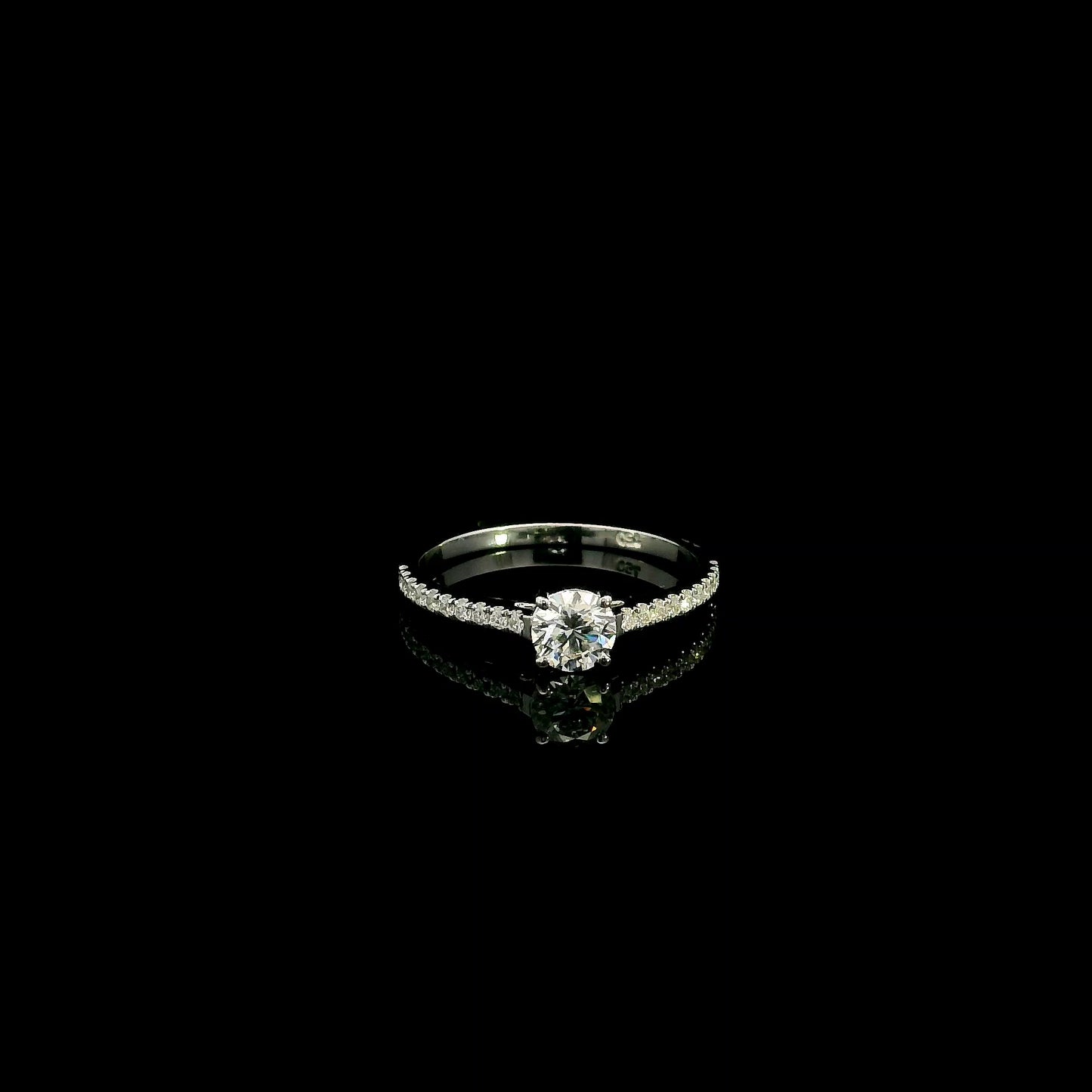 18K white gold round brilliant diamond solitaire engagement ring featuring a 0.51 carat GIA certified natural diamond with a pavé diamond band.