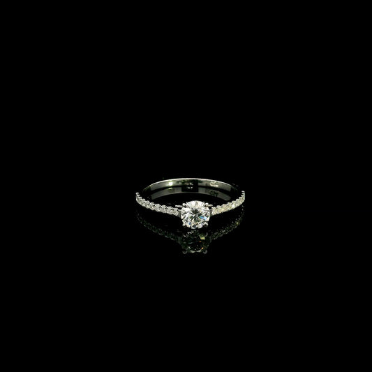 18K white gold round brilliant diamond solitaire engagement ring featuring a 0.51 carat GIA certified natural diamond with a pavé diamond band.