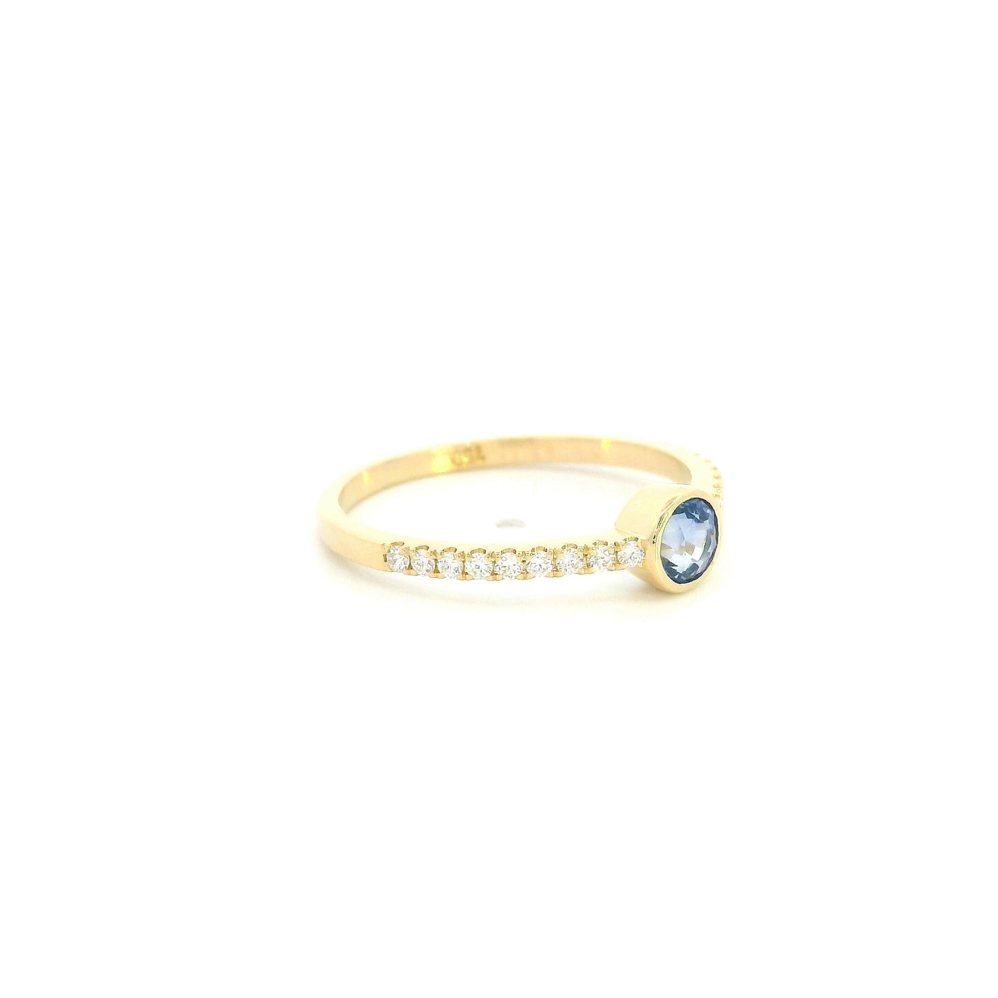 18K yellow gold bezel blue sapphire diamond ring featuring a 0.62 Carat natural round sapphire with diamond-set shoulders.