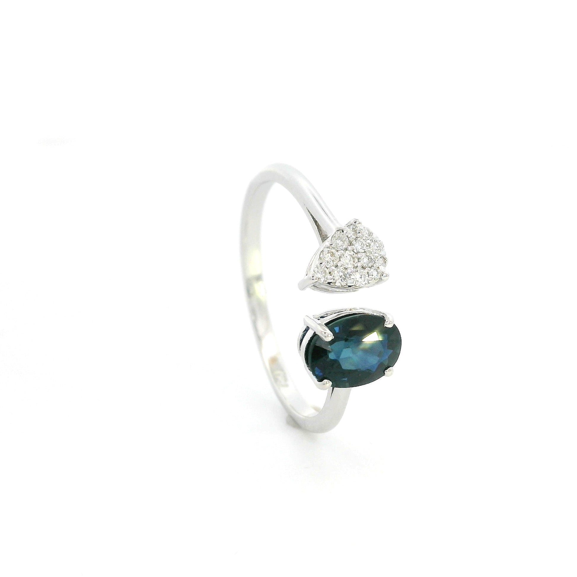 18K white gold blue sapphire diamond open ring featuring a 1.07 Carat natural oval sapphire with a pear-shaped natural diamond cluster.