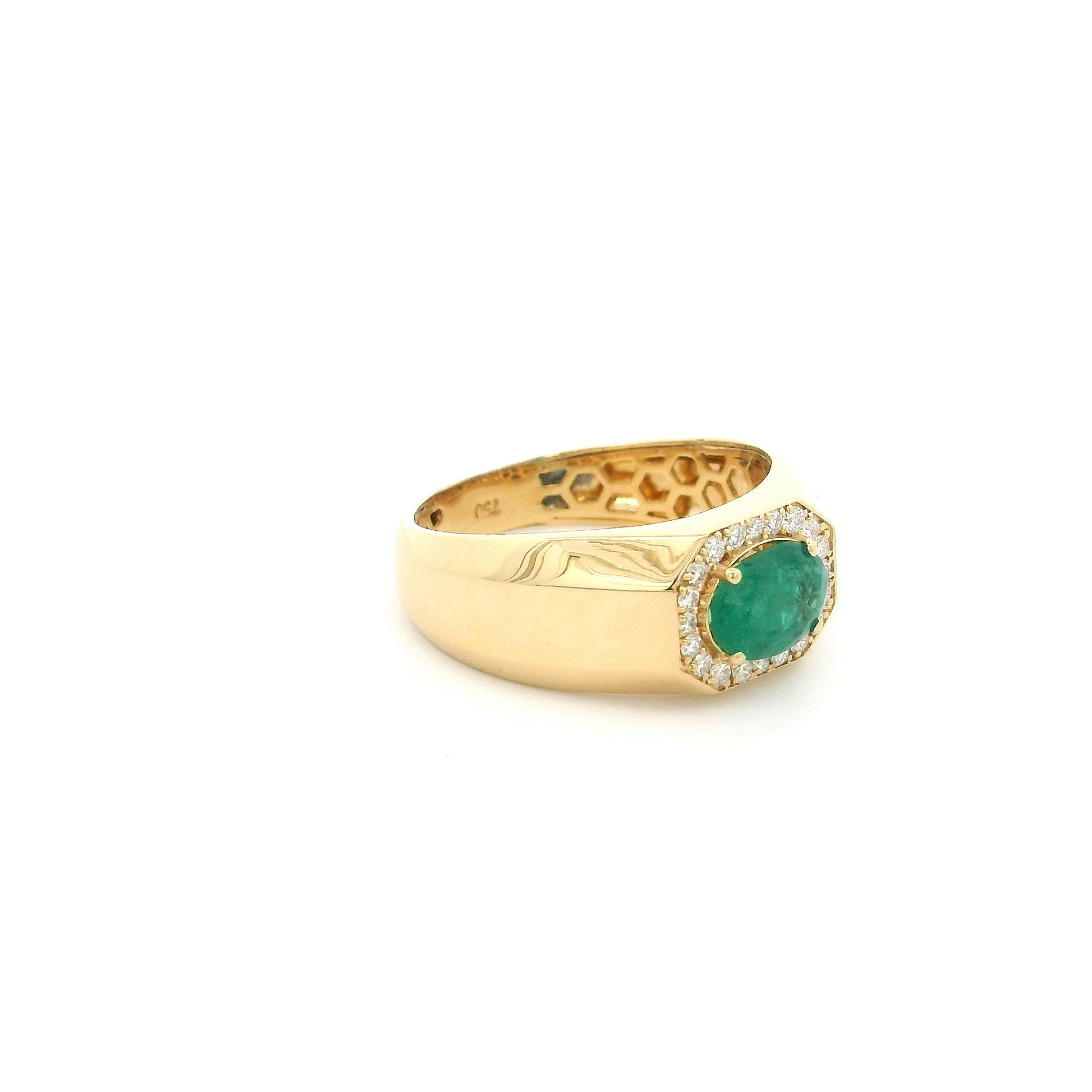 18K yellow gold men's signet ring featuring a 1.15 carat natural oval emerald surrounded by a halo of natural diamonds with a bold polished gold band.
