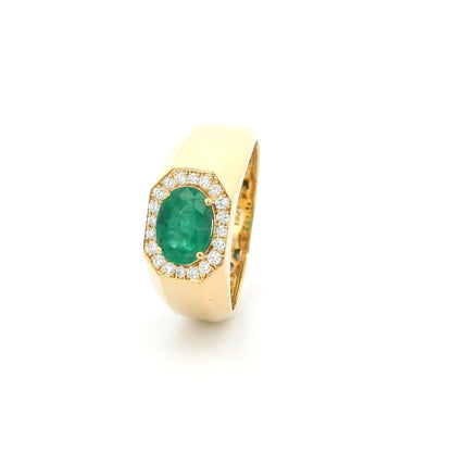 18K yellow gold men's signet ring featuring a 1.15 carat natural oval emerald surrounded by a halo of natural diamonds with a bold polished gold band.