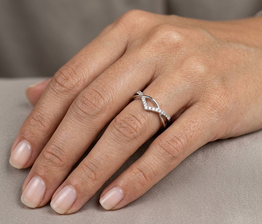 18K white gold diamond crossover ring with curved V shaped design