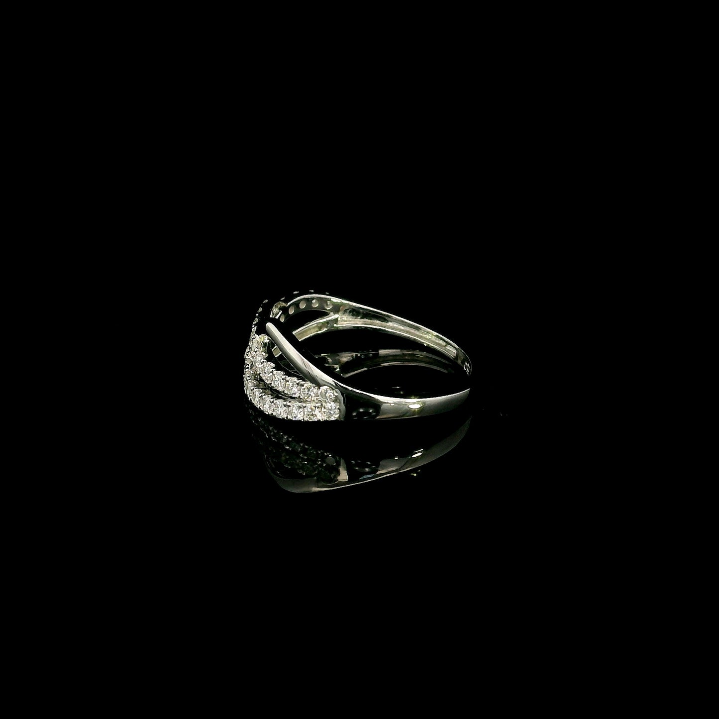 18K white gold diamond crossover ring featuring an elegant flowing design with 0.39 carat natural pavé-set diamonds.