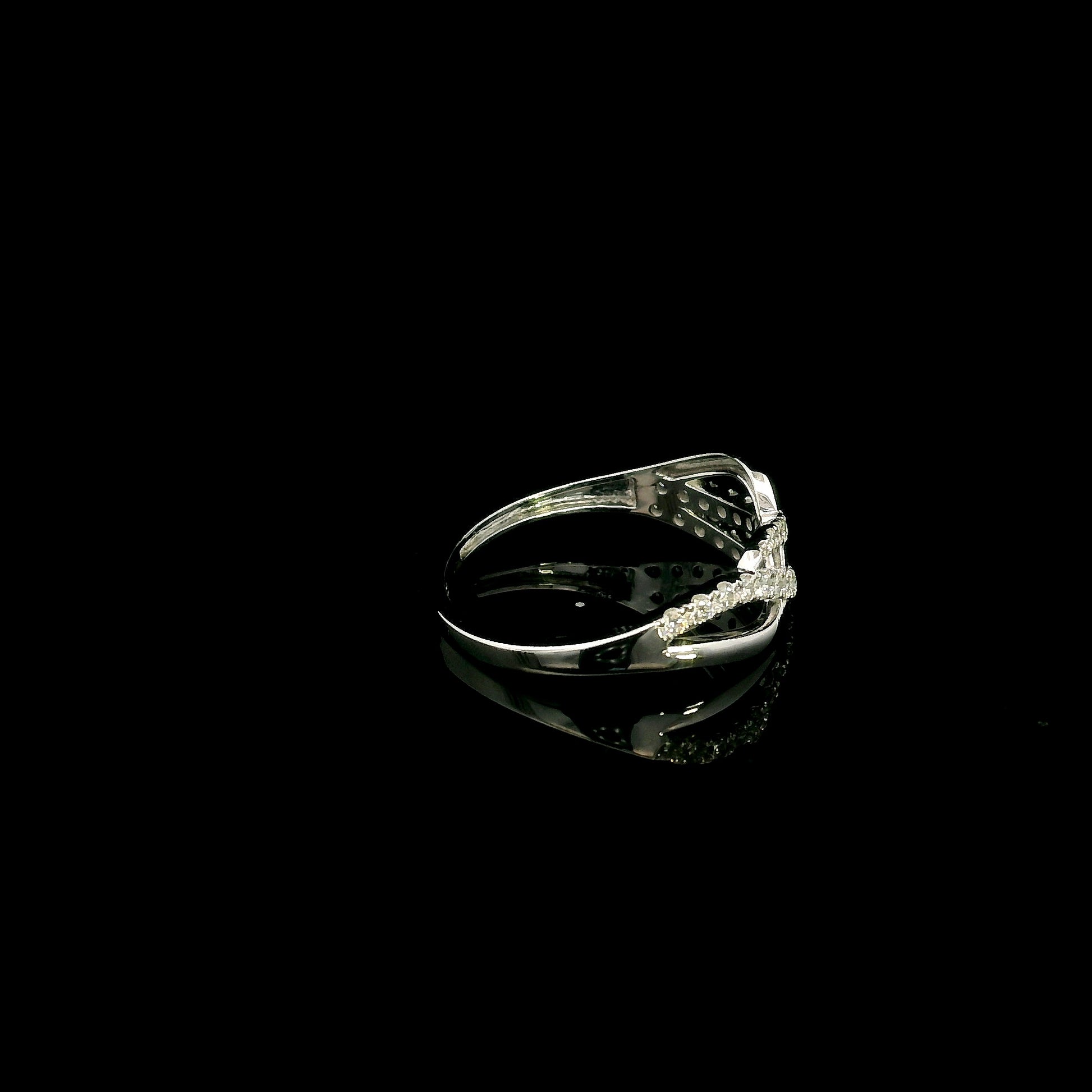 18K white gold diamond crossover ring featuring an elegant flowing design with 0.39 carat natural pavé-set diamonds.