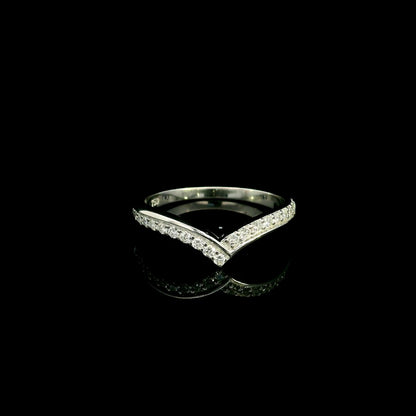 18K white gold chevron diamond wedding band featuring 0.27 carat natural round brilliant diamonds in a pavé setting.