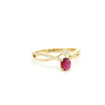 18K yellow gold oval ruby ring featuring a 0.31 Carat natural ruby with pavé diamond split crossover shoulders.