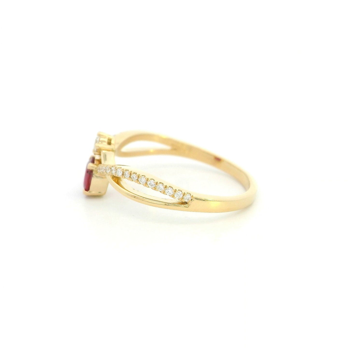 18K yellow gold oval ruby ring featuring a 0.31 Carat natural ruby with pavé diamond split crossover shoulders.