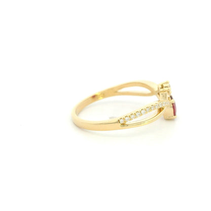 18K yellow gold oval ruby ring featuring a 0.31 Carat natural ruby with pavé diamond split crossover shoulders.