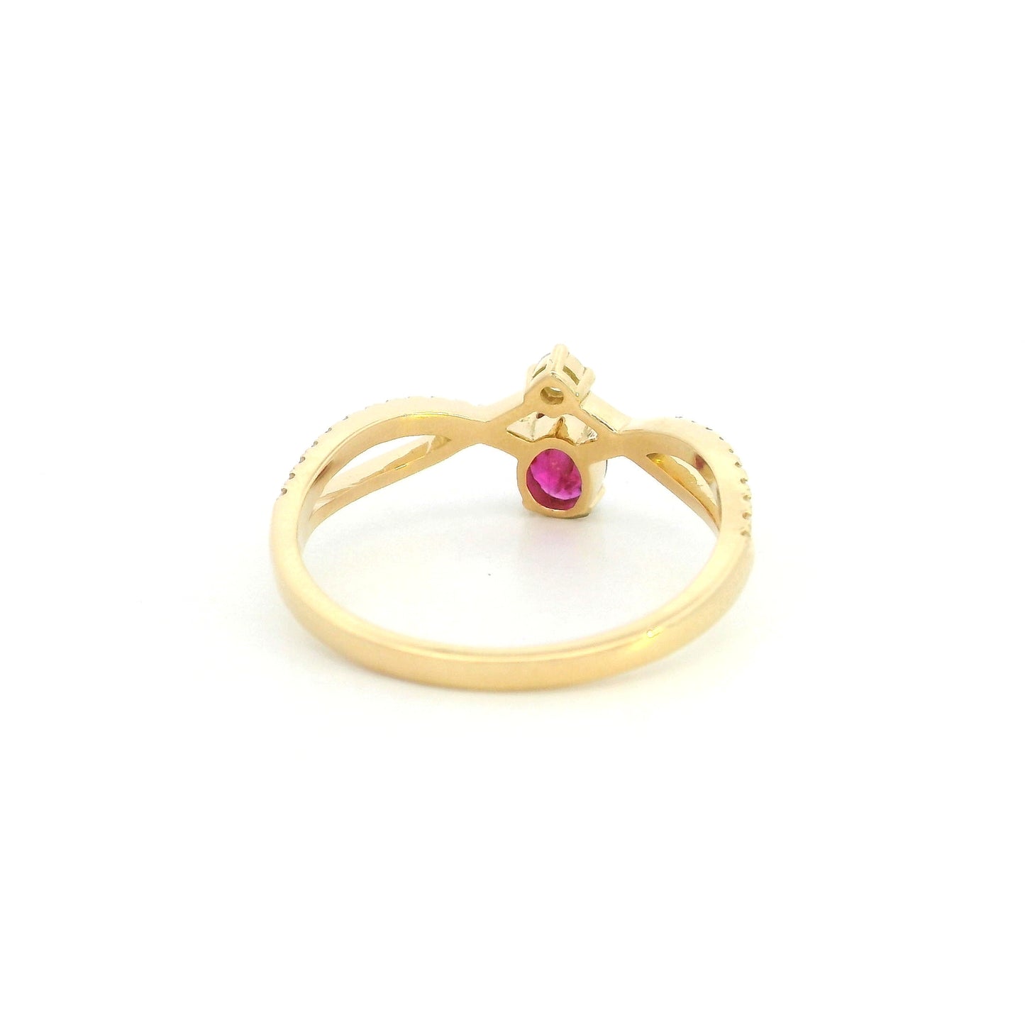 18K yellow gold oval ruby ring featuring a 0.31 Carat natural ruby with pavé diamond split crossover shoulders.